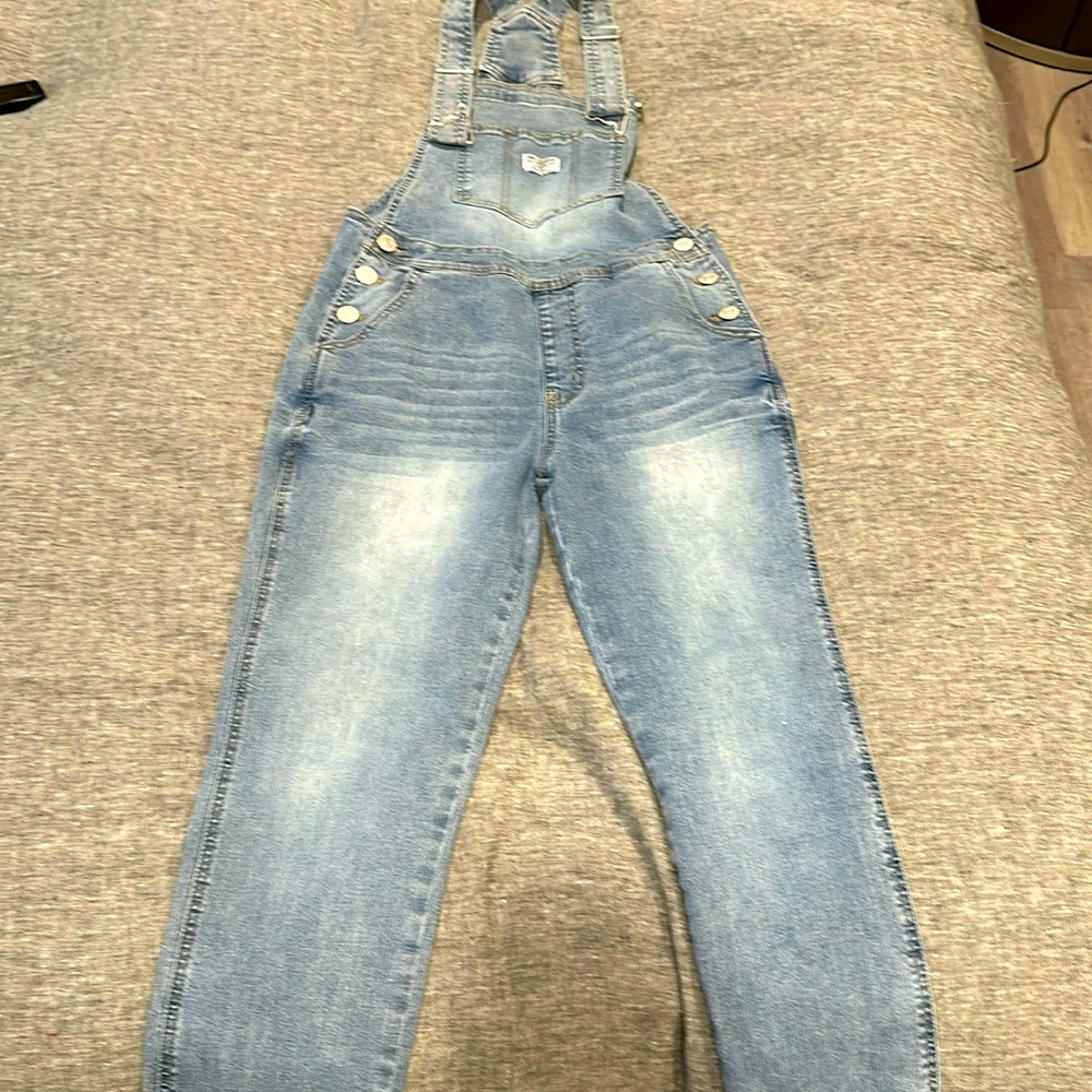 Lighter wash overalls.